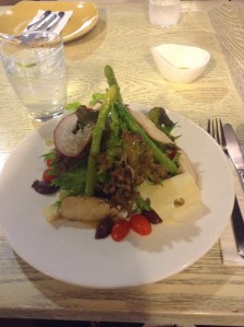 Cute little cafe fancy roasted chicken salad with asparagus. 