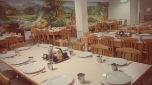 Dining room! The beautiful mural was painted by a brother. Originally the mural was only half this big but when Bethel expanded the dining room and added onto the wall he came back and continued the painting to double it's size!